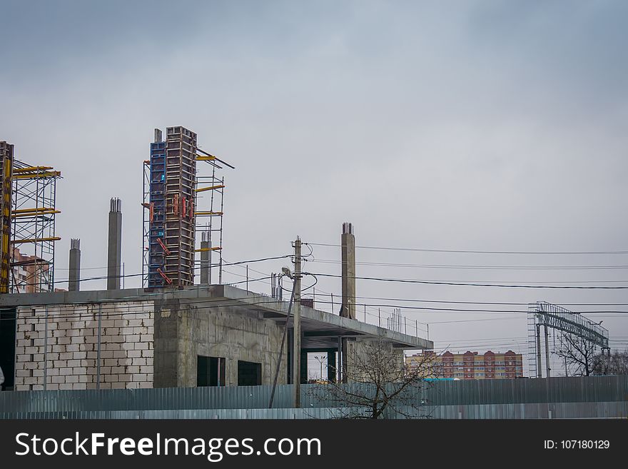 Construction of a big building in the rural town. Construction of a big building in the rural town.