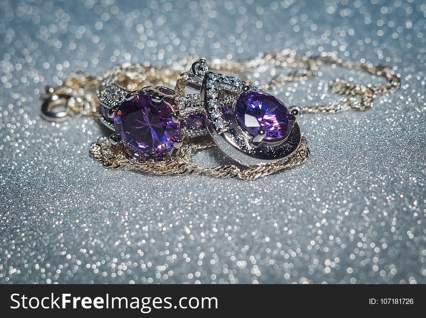 Fashion silver pendant with purple zirconia, amethyst imitation.