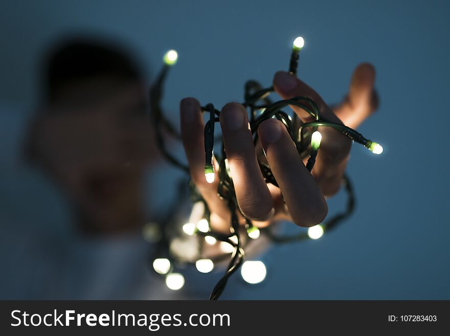 Hand with the christmas lights