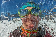 Girl Looks Through A Transparent Ice Floe On The Lake Baikal Stock Photos