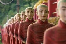 Buddhist Monks Stone Statues Row At Kaw Ka Thaung Cave Stock Photos