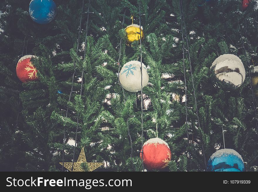 Fir tree decorated with colorful balls for Christmas time, filtered. Fir tree decorated with colorful balls for Christmas time, filtered.