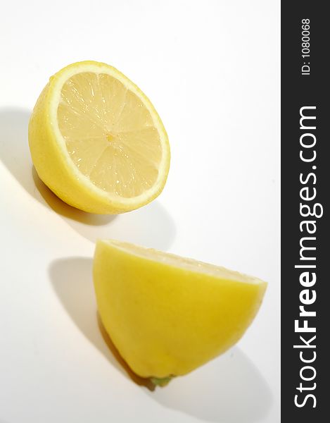 One lemon and slice on white background. One lemon and slice on white background