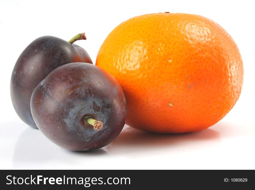 Fruit isolated. Orange and Plums. Fruit isolated. Orange and Plums