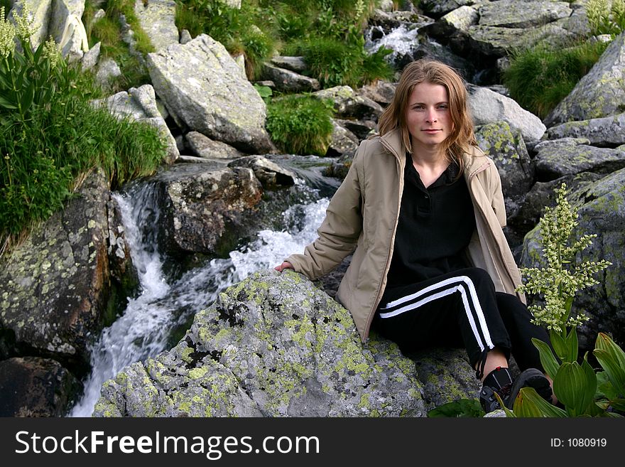 Women portrait near waterfall