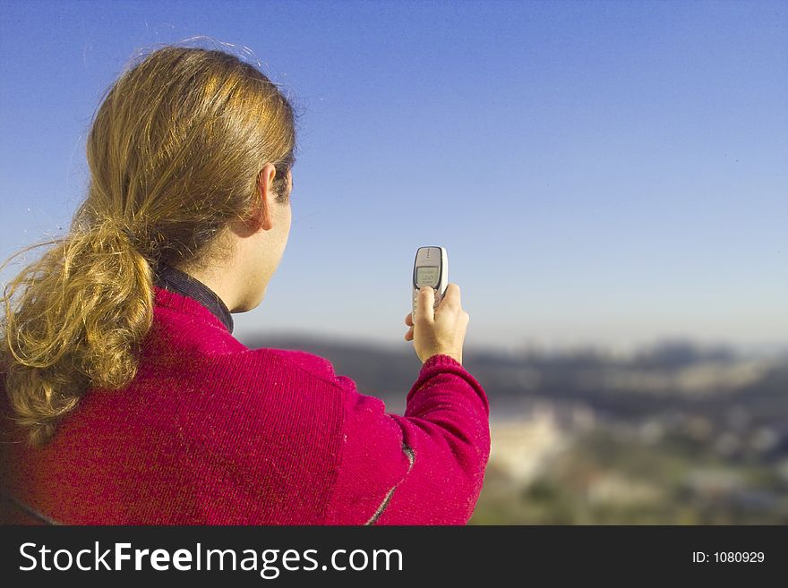 Man taking picture with a mobile phone