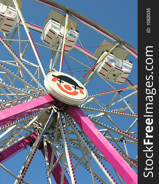 View of how high a Ferris Wheel look from the ground up.