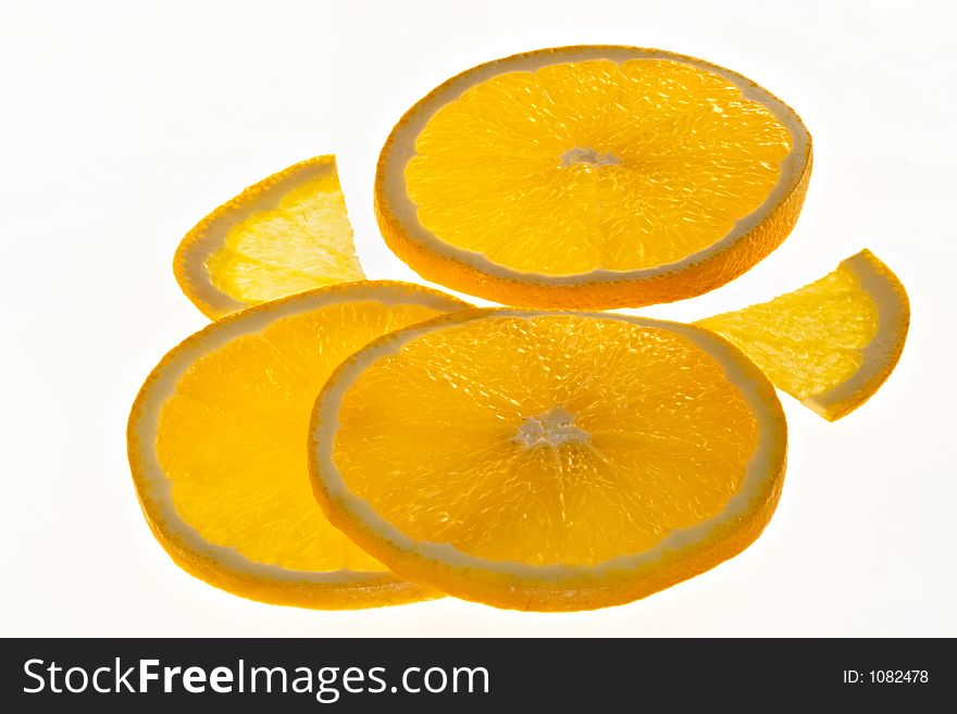 Slices of  fresh orange on a white background. Slices of  fresh orange on a white background