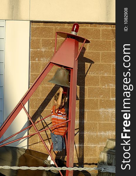 Child RInging a Bell