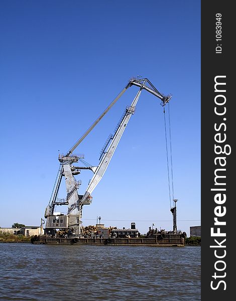 Harbour crane on the river