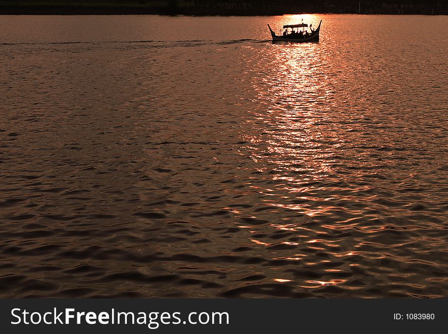 Couples enjoying gondola ride in sunset. Couples enjoying gondola ride in sunset