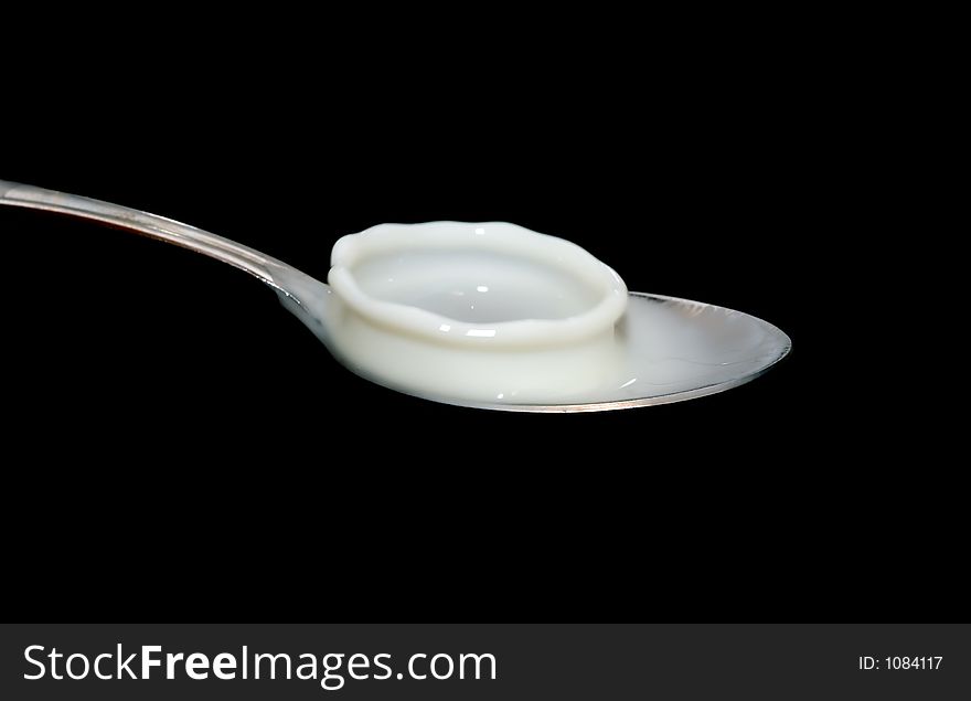 Milk splash on spoon