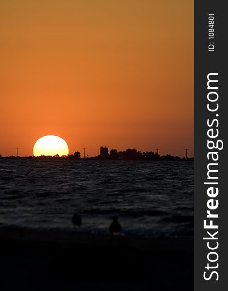 Sea Sunrise landscape, with buildings in the foreground. Sea Sunrise landscape, with buildings in the foreground