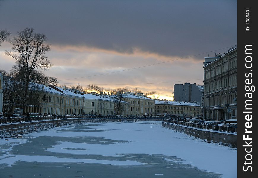 Sunset over Moika river in winter Saint-Petersburg. Sunset over Moika river in winter Saint-Petersburg