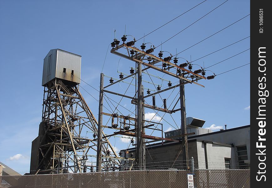 Tower at a salt mine site with power lines in foreground. Tower at a salt mine site with power lines in foreground