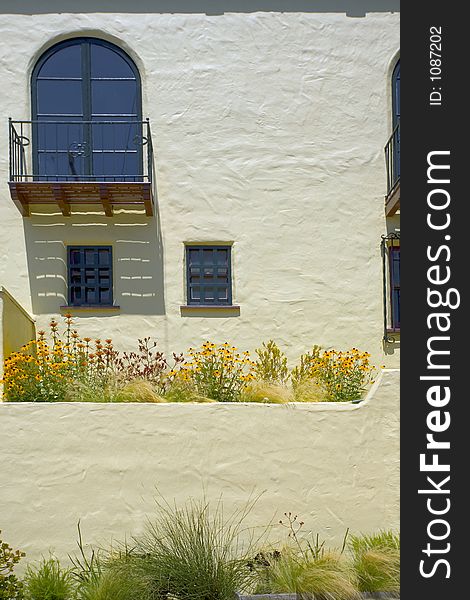 Stucco wall with balcony.