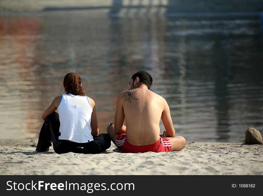 Couple in the beach with tattoo