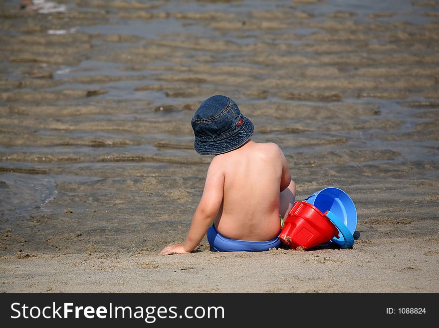 Boy in the beach playing
