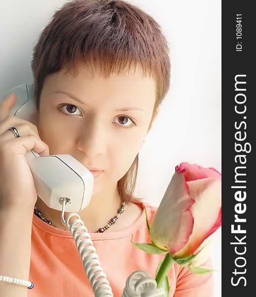 Girl with rose speak phone. Girl with rose speak phone