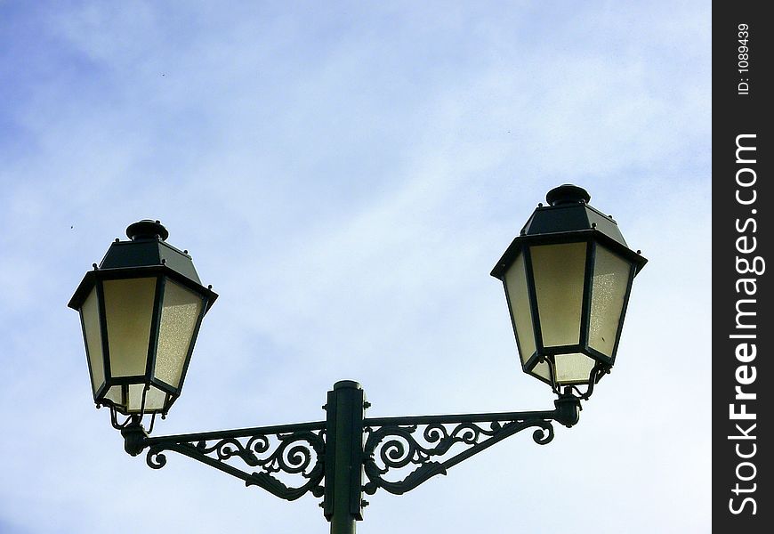 Oil lamp with lanterns in a square of the city of Elvas, south of Portugal