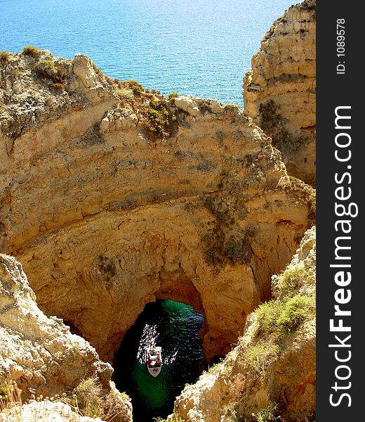 Grotto zone and interesting rocky formations, in Lakes, Algave. In the summer the fishing make visits guided to the tourists in its boats of fish. Grotto zone and interesting rocky formations, in Lakes, Algave. In the summer the fishing make visits guided to the tourists in its boats of fish.