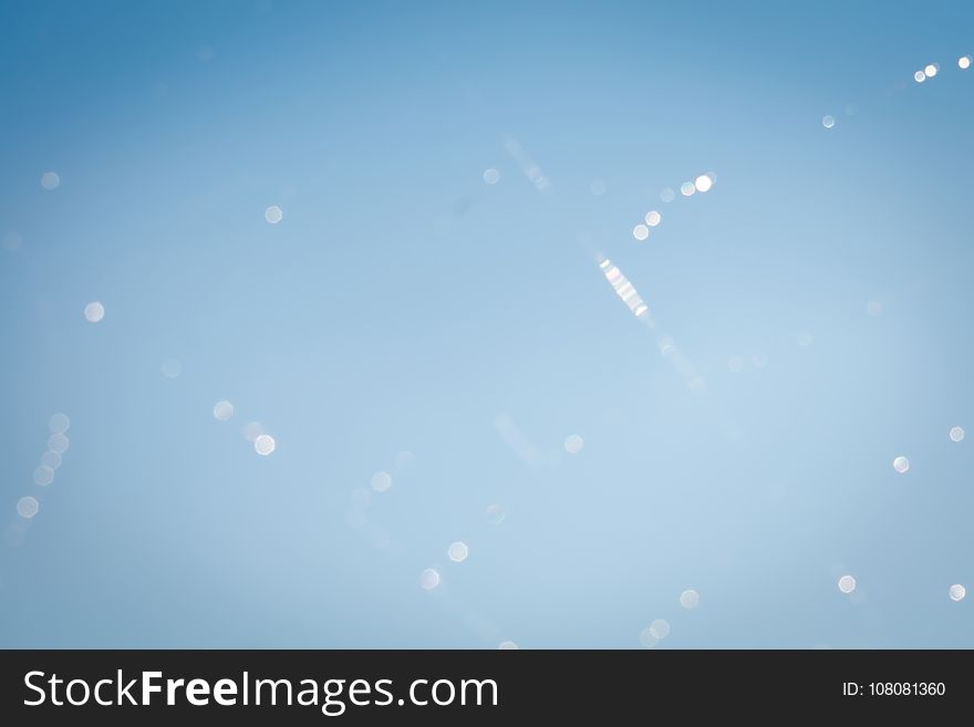 Blurred Waterdrops On Cobweb