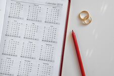 Planning A Wedding In 2018. Calendar Of 2018 And Two Wedding Rings And On White Background Stock Images