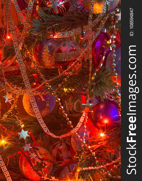 Decorated Christmas tree and colorful garland lights. Decorated Christmas tree and colorful garland lights.