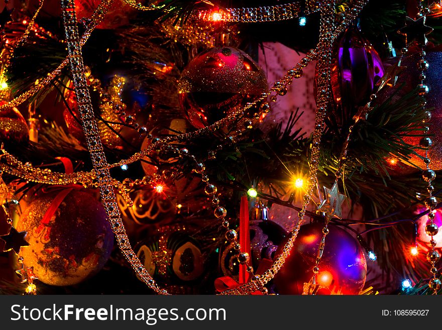 Decorated Christmas tree and colorful garland lights. Decorated Christmas tree and colorful garland lights.