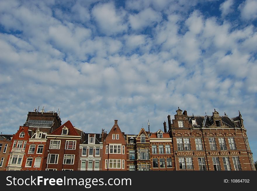 Amsterdam canal Houses in Holland with a blue sky