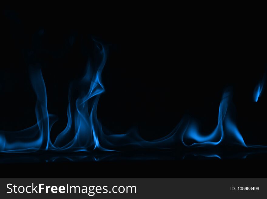 Beautiful fire blue flames on a black background. Beautiful fire blue flames on a black background.