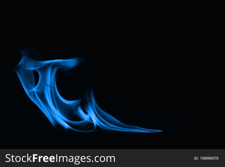 Beautiful fire blue flames on a black background. Beautiful fire blue flames on a black background.