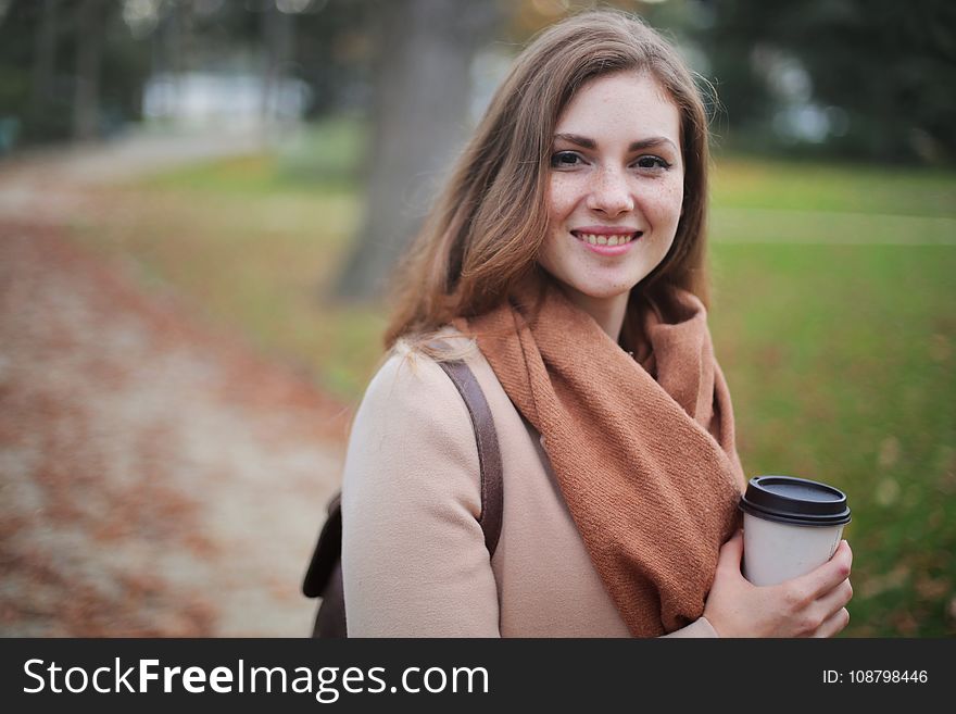 Woman Holding Disposable Cup