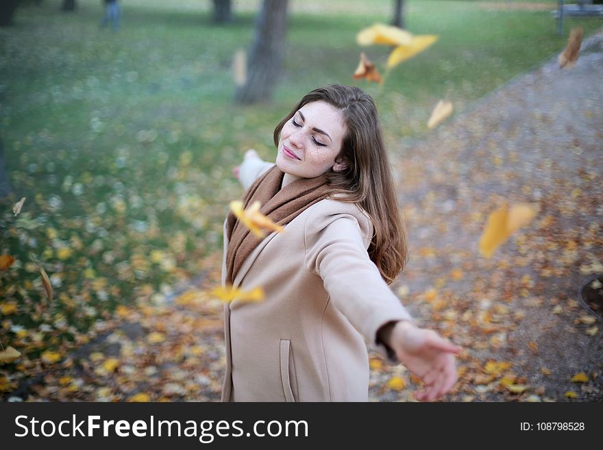 Woman Open Arms While Closed-eyes Smiling Photo