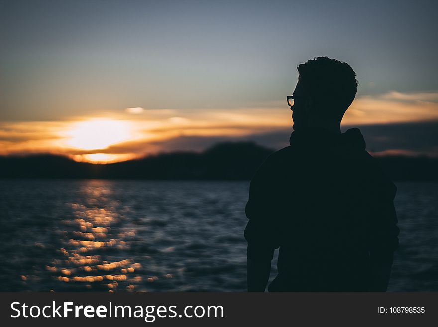 Silhouette of Man during Sunrise