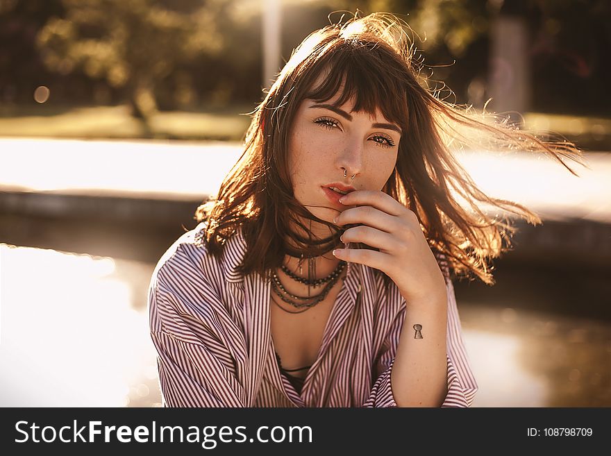 Woman In Red And White Stripes Top Photo