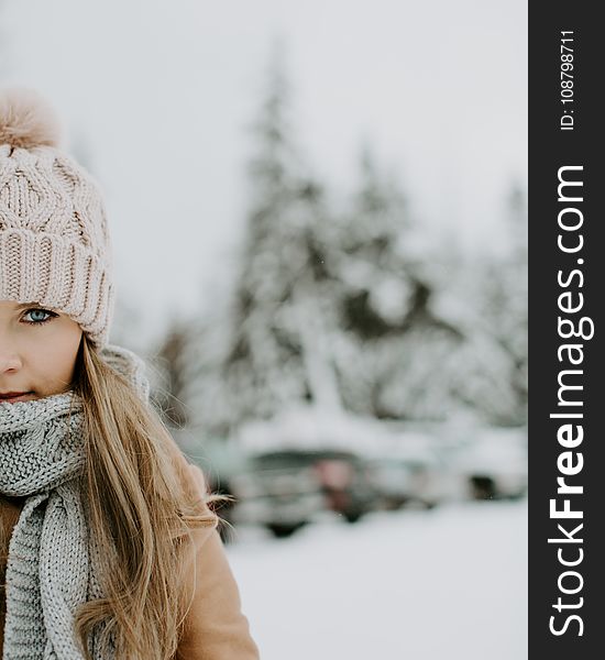Girl Wearing Winter Outfit on Snowy Field