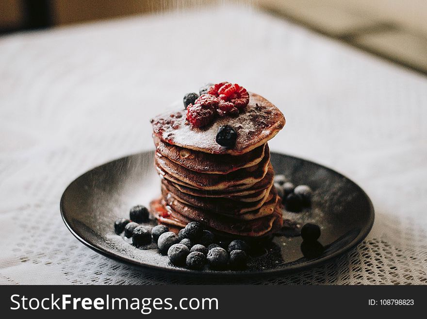 Pancakes With Blueberries On Black Plae