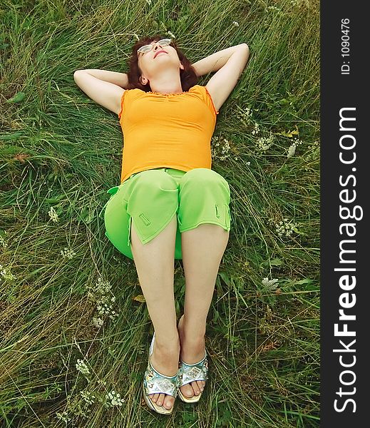 Girl reposes on grass, meadow. Girl reposes on grass, meadow