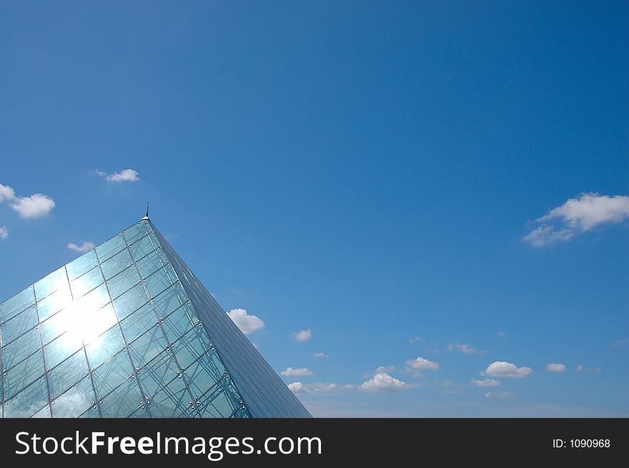 The blue sky and glassy cupola