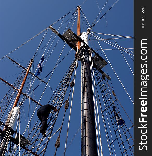 A crewmember climbing the rigging of The Empire Sandy at Canal Days in Port Colborne, Ontario. August 5/2006