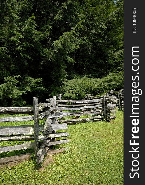 Split Rail Fence against pine tree background. Split Rail Fence against pine tree background.