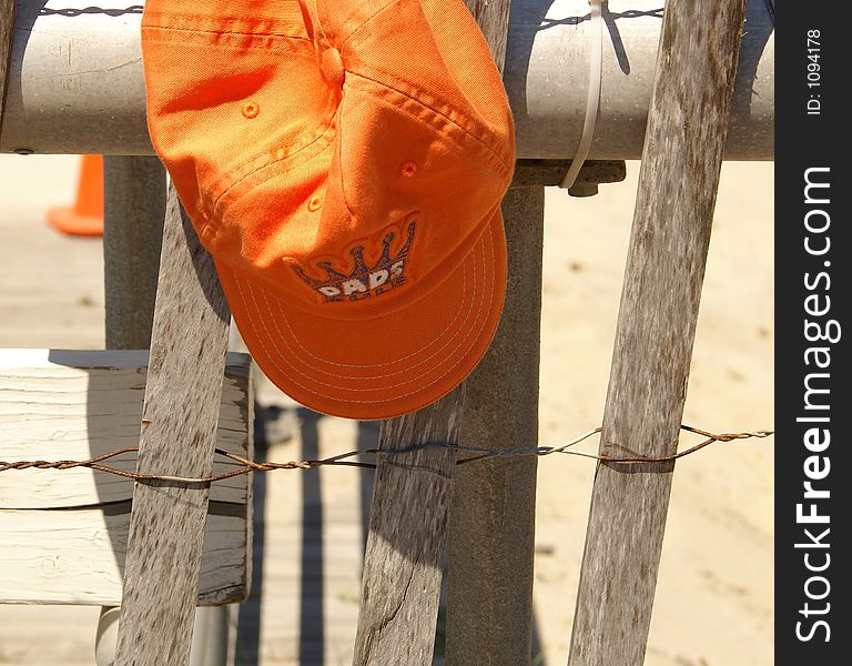 Dad's hat on a fence