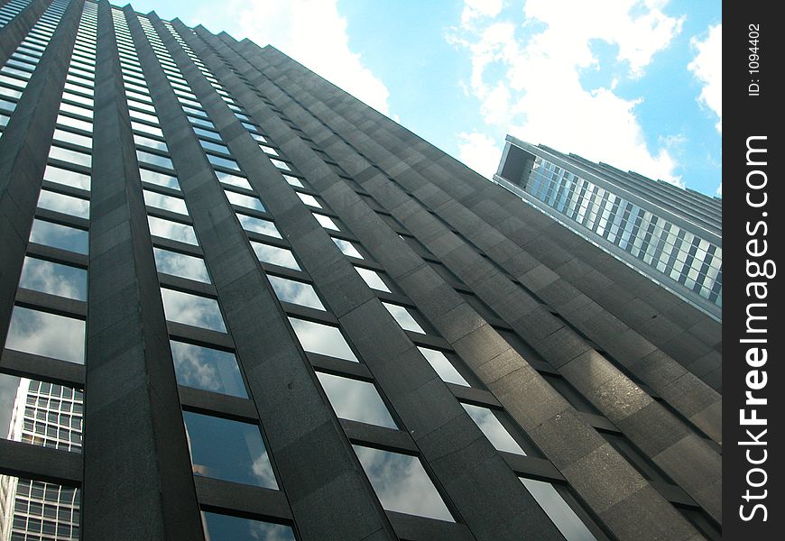 Building in Midtown Manhattan with reflection of sky. Building in Midtown Manhattan with reflection of sky.