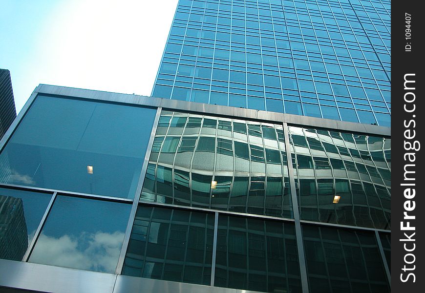 Building in Midtown Manhattan with reflection of sky. Building in Midtown Manhattan with reflection of sky.