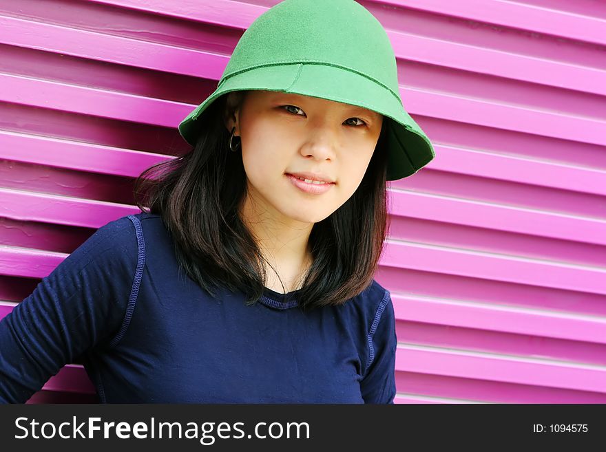 Pretty Korean woman wearing a green hat and navy blue top. Pretty Korean woman wearing a green hat and navy blue top