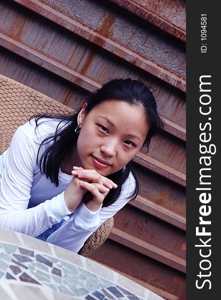 Portrait of a Korean woman sitting at a table. Portrait of a Korean woman sitting at a table