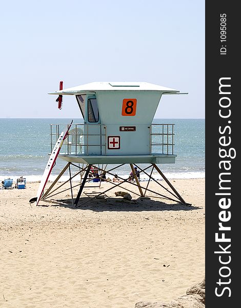 Lifeguard station on beach overlooking sunbathers. Lifeguard station on beach overlooking sunbathers.