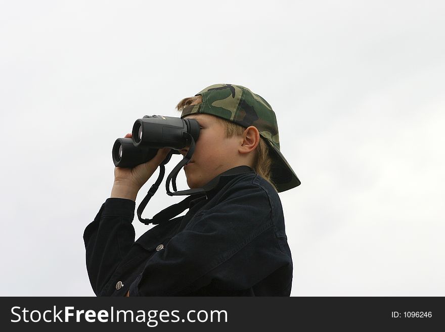 Teen Using Binoculars. White background. Teen Using Binoculars. White background