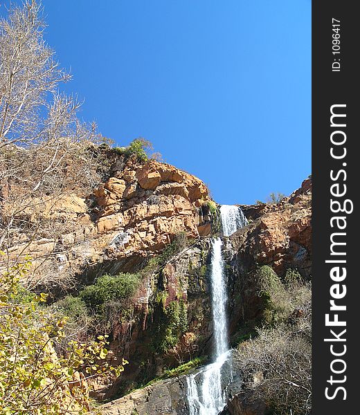 Rocky African Waterfall And Trees